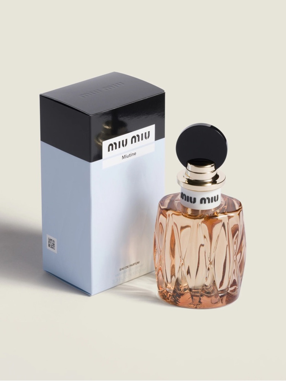 Miu Miu Eau de Parfum Bottle with Light Peach Glass and Black Cap